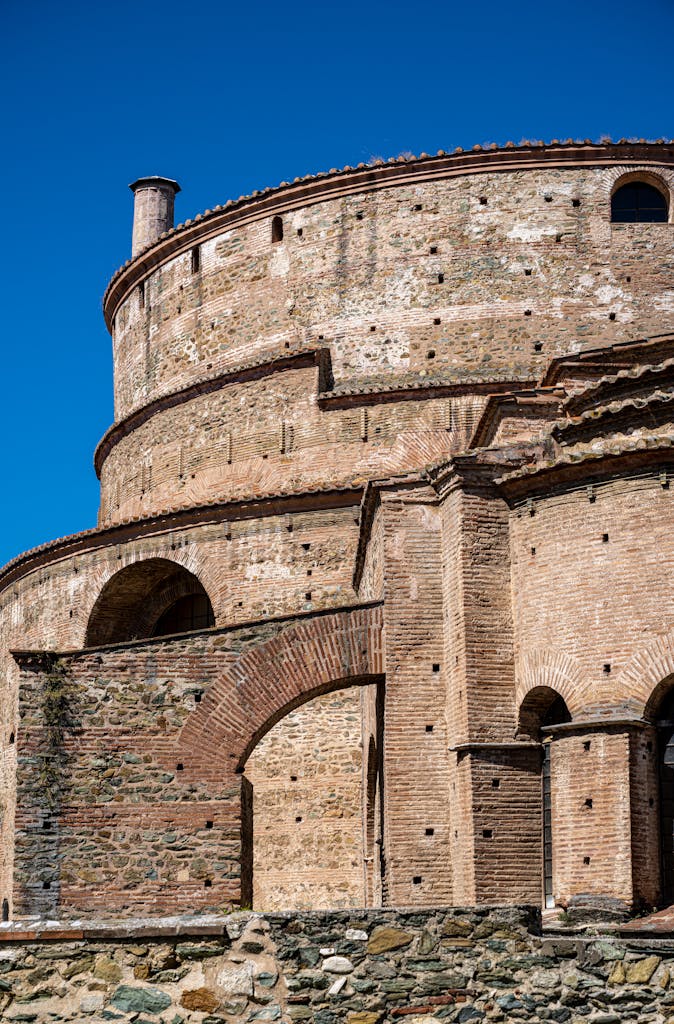 Historic Rotunda landmark in Thessaloniki, Greece under clear summer skies.